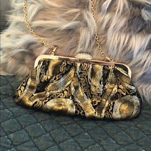 Evening bag with gold and black sequins.